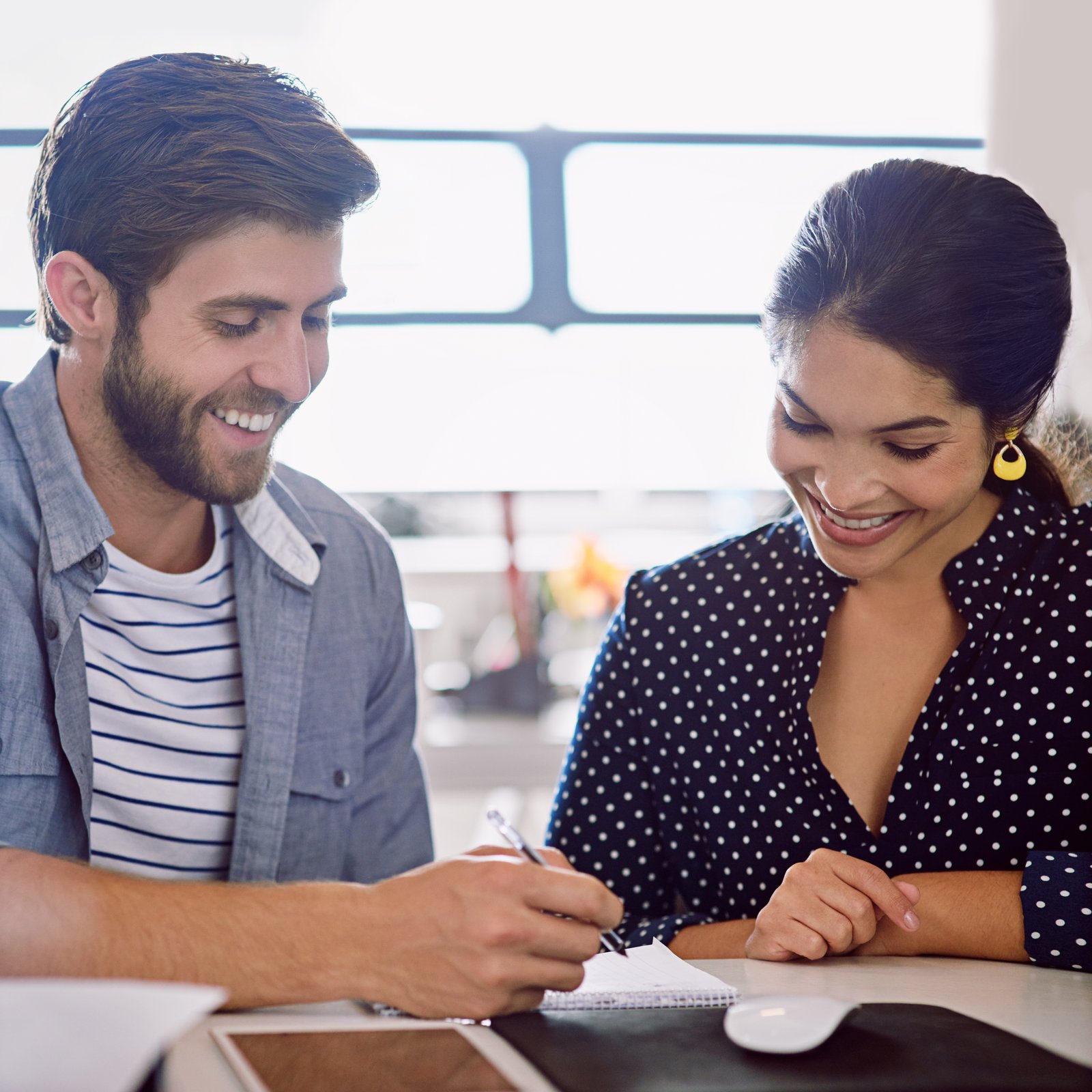 A family organizing tax documents together at the kitchen table